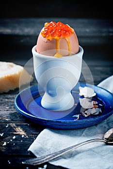 Soft-boiled egg with red caviar