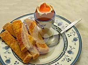 Soft Boiled Egg with Soldiers on plate with Spoon