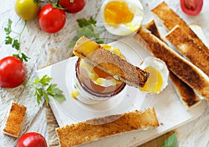 Soft-boiled egg with toasts