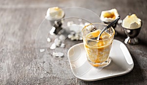 Soft-boiled eggs in a glass cup for breakfast