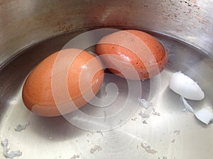 Soft-boiled eggs in the stainless pot.