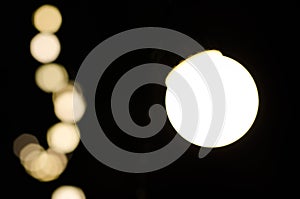 Soft bokeh background. Garland of electric lights. Place to add