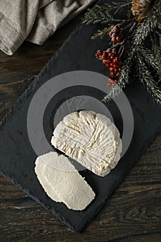 Soft white cheese on the black board