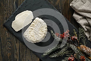 Soft white cheese on the black board