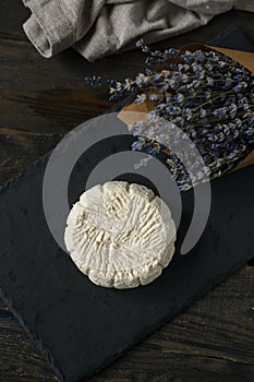 Soft white cheese on the black board