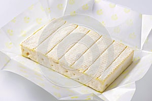 Soft cheese with thin white rind photo