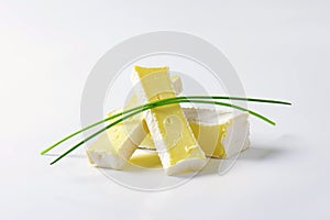 Soft cheese with thin white rind photo