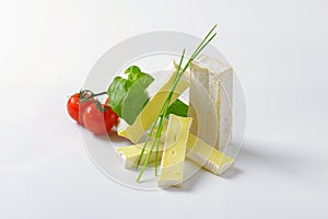 Soft cheese with thin white rind photo