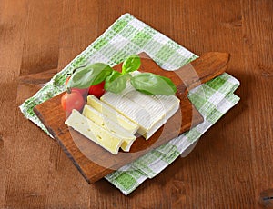 Soft cheese with thin white rind photo