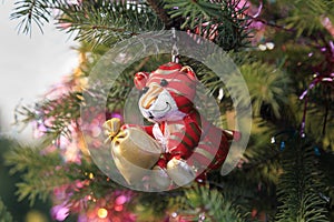 Soft Christmas tree toy tiger cub on the tree