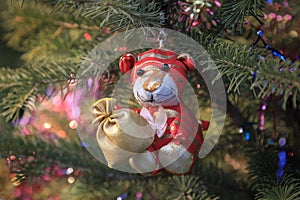 Soft Christmas tree toy tiger cub on the tree