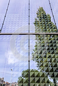 Soft cloudy sky and reflex in modern building background