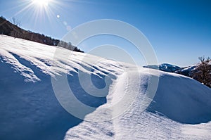 Soft, cold, white snow.