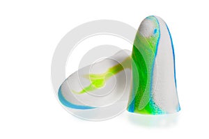 Soft colorful ear plugs on white background photo