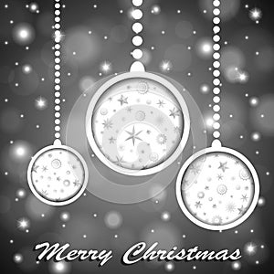 Soft colors silver shiny Christmas toys with stars and snowflakes cuted in paper on blurred background