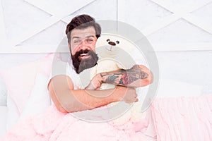 Soft cotton bedclothes. Bearded man relaxing. Circadian rhythm is natural internal process that regulates sleep wake photo