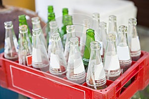 Soft drink bottle in red plastic crates