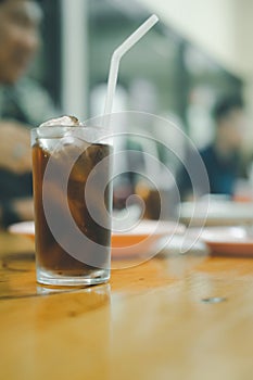 Soft drink in glass with ice on table at Thai local restaurants