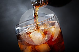 Soft drink, pouring cola into glass