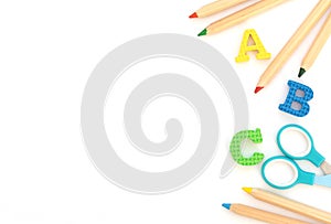 Soft English letters with school and office supplies on white background. Back to school, stationary concept. Kid`s set for