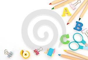 Soft English letters with school and office supplies on white background. Back to school, stationary concept. Kid`s set for