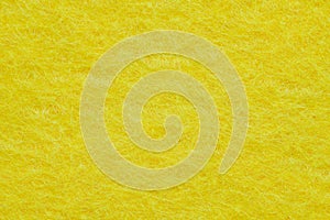 Soft felt textile material yellow color, colorful texture flap fabric background