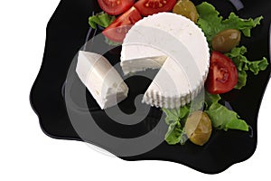 Soft feta cheese with gold olives