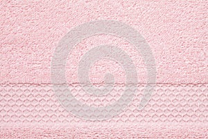 Soft, fluffy pink towel texture. Hotel, spa, comfortable bathroo