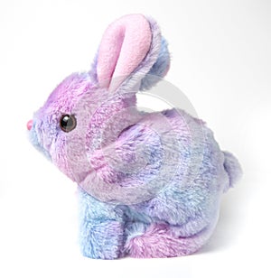 Soft fluffy rabbit toy with long ears, isolated on a white background