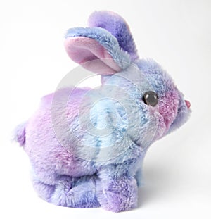 Soft fluffy rabbit toy with long ears, isolated on a white background