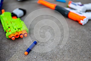 Soft foam dart gun loaded and ready for use by children.