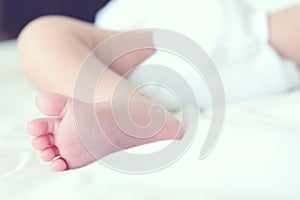 Soft focus and blurry of Baby Feet, vintage style color effect