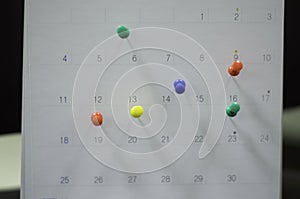 Soft focus- close up calendar with pins for reminders and deadline,appointments Important, organize to manage of time, and meeting photo