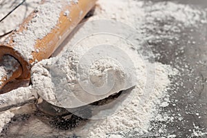 Soft focus close-up, flour ears of wheat barley cooking, bread, and cookies arranged on a wooden table surface in a rustic kitchen