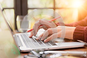 Soft focus Closeup woman hand working on her laptop.