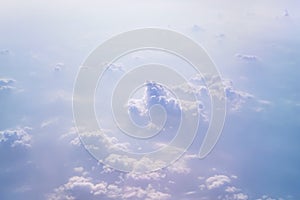 Soft focus of cloudscape or white cloud and blue sky from window of air plane.