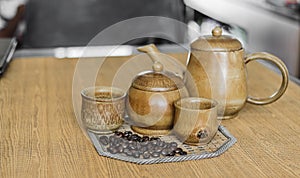 Soft focus image of coffee beans and coffee cups set.