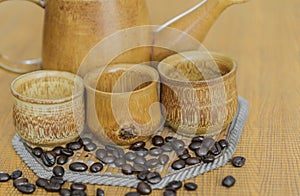 Soft focus image of coffee beans and coffee cups set.