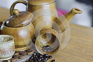 Soft focus image of coffee beans and coffee cups set.