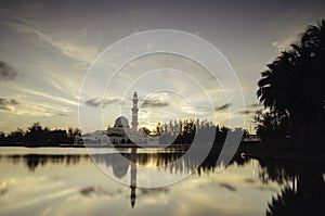 Soft focus image of iconic floating mosque at Terengganu, Malaysia . The beauty reflection on the lake and soft focus background