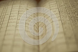 Soft focus of an old book of local records with list of residents\' names and information