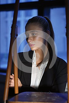 Soft focus portrait of pretty girl in dark room highlighted with spotlight