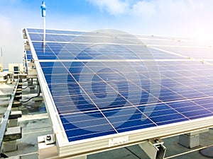 Soft focus of Solar panels or Solar cells on factory rooftop or terrace with sun light, Industry in Thailand, Asia.
