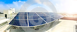 Soft focus of Solar panels or Solar cells on factory rooftop or terrace with sun light, Industry in Thailand, Asia.