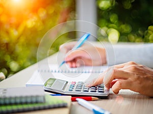 Soft focus woman hand working with calculator