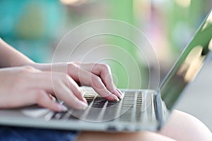 Soft focus of young woman of freelancer working using laptop computer in coffee shop, Communication technology and Business