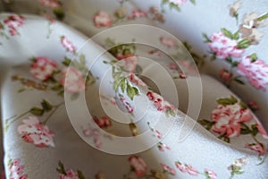 Soft fold on grey rayon with old-fashioned floral print photo