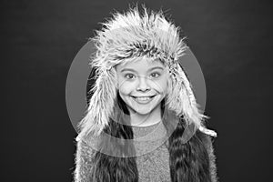 Soft furry accessory. Tips for caring for fur garments. Child long hair soft hat enjoy softness. Winter fashion concept