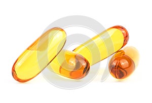 Soft gelatin capsules pills isolated on white background. Natural health supplement for brain efficacy. Tuna fish oil