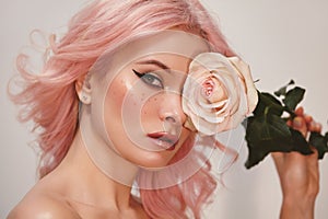 Soft-Girl Style with Trend Pink Flying Hair, Fashion Make-up. Blond Woman Face with Freckles, Blush Rouge, Rose Flowers